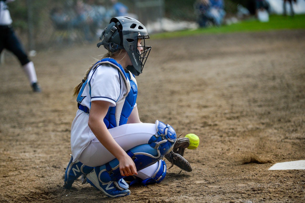 girl catching the baseball